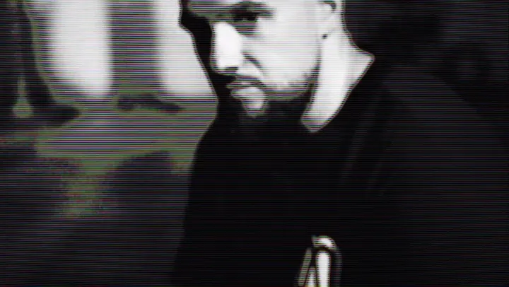 A black and white portrait of an athlete