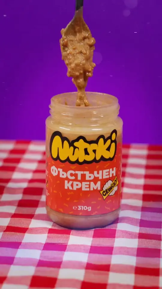 A spoon drip over the jar on gingham